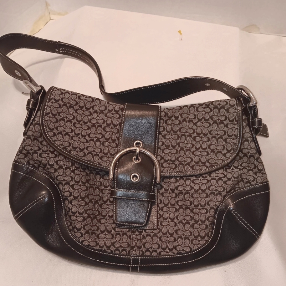 Signature Coach leather trim shoulder bag.